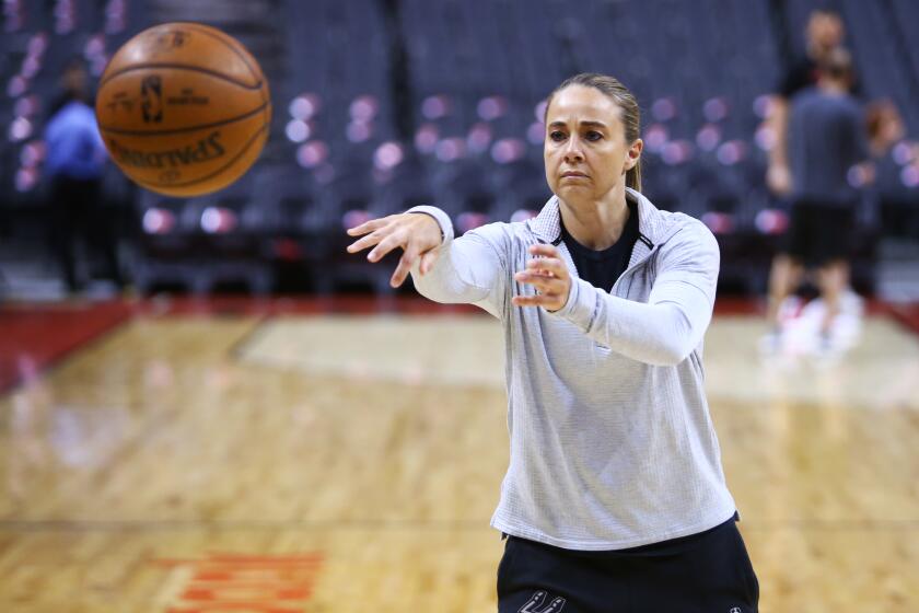 TORONTO, ON - FEBRUARY 22: Assistant Coach Becky Hammon of the San Antonio Spurs passes the ball during warm up prior to an NBA game against the Toronto Raptors at Scotiabank Arena on February 22, 2019 in Toronto, Canada. NOTE TO USER: User expressly acknowledges and agrees that, by downloading and or using this photograph, User is consenting to the terms and conditions of the Getty Images License Agreement. (Photo by Vaughn Ridley/Getty Images)
