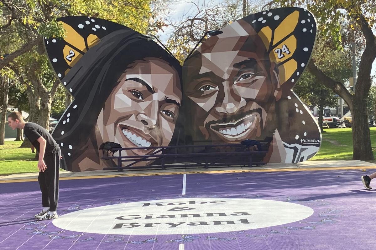 A butterfly-shaped mural in Pearson Park features the images of Kobe and Gianna Bryant.