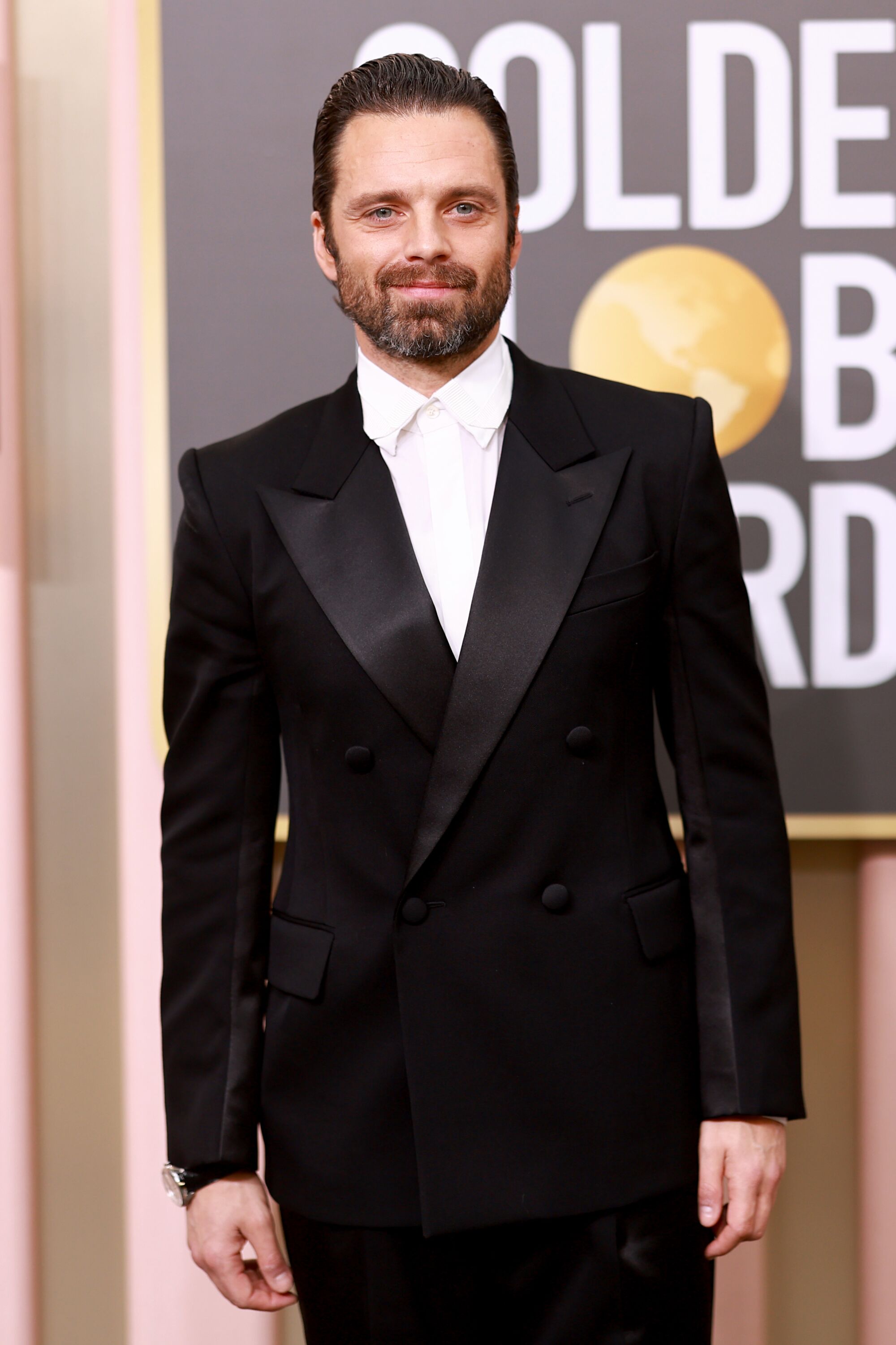 Sebastian Stan poses in black Lanvin at the Golden Globes