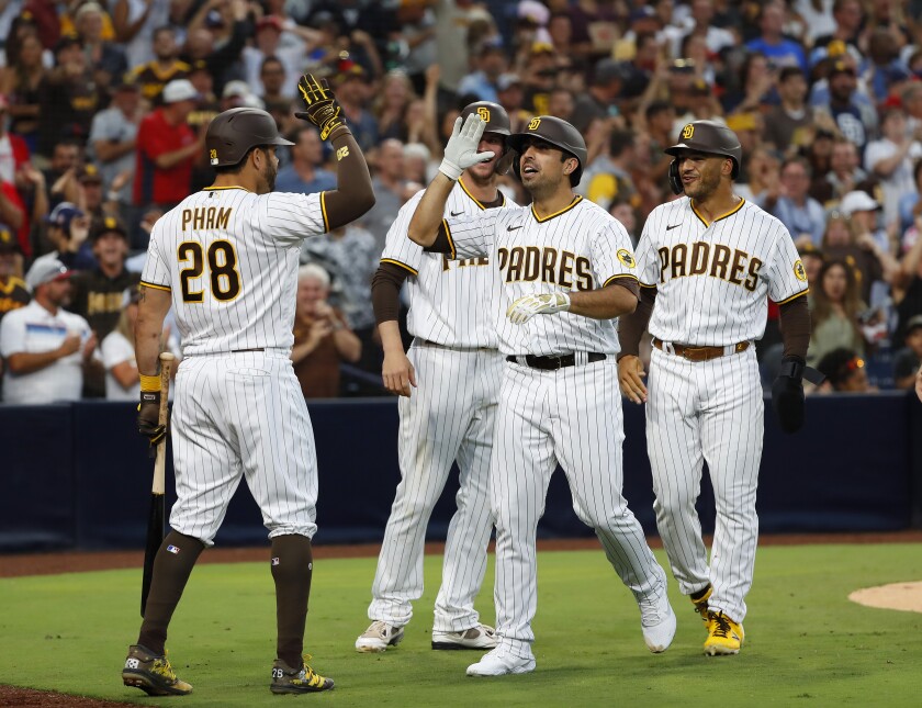Padres' Daniel Camarena (center) celebrates after hitting a grand slam against Washington on July 8 at Petco Park.