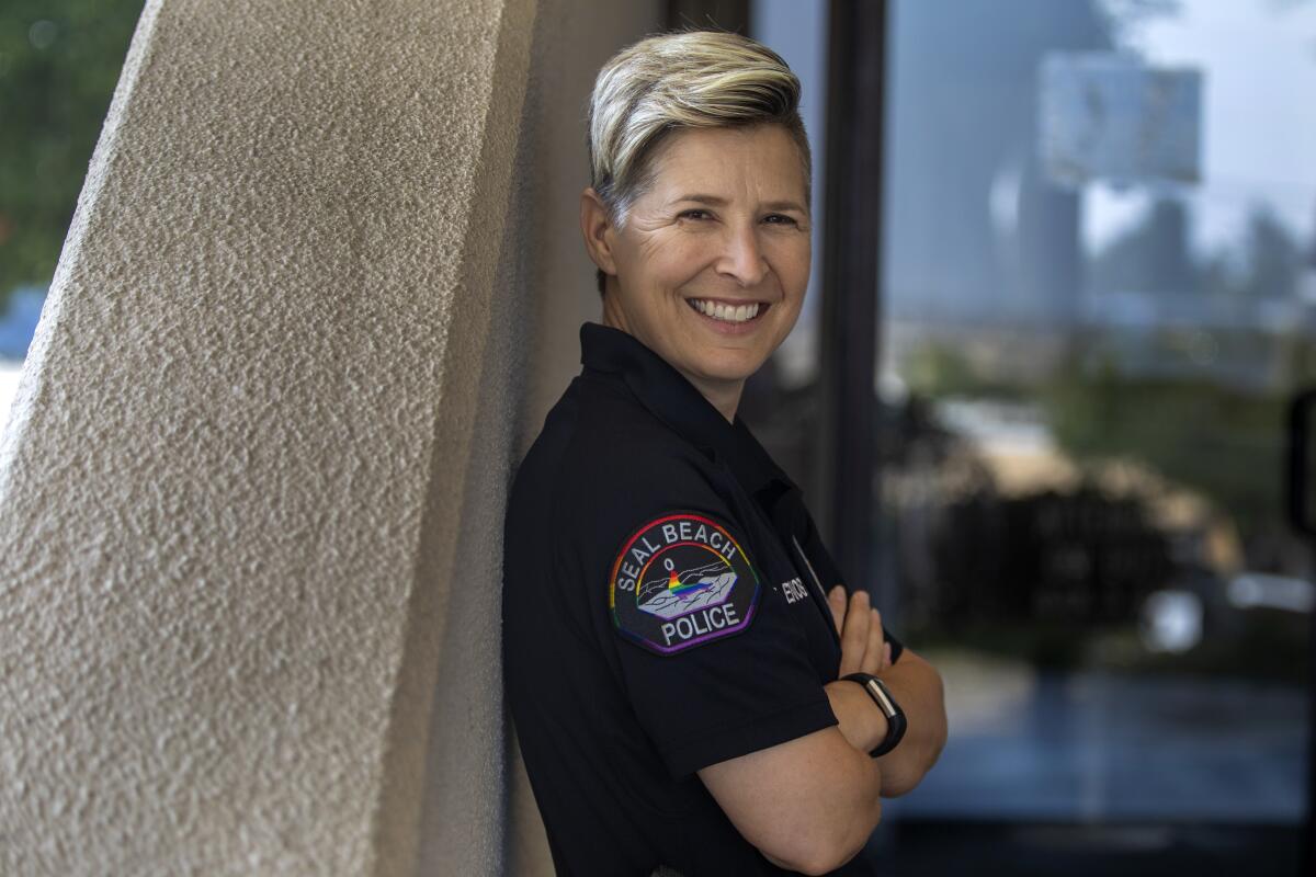 Officer Erin Enos stands outside the Seal Beach Police Department.