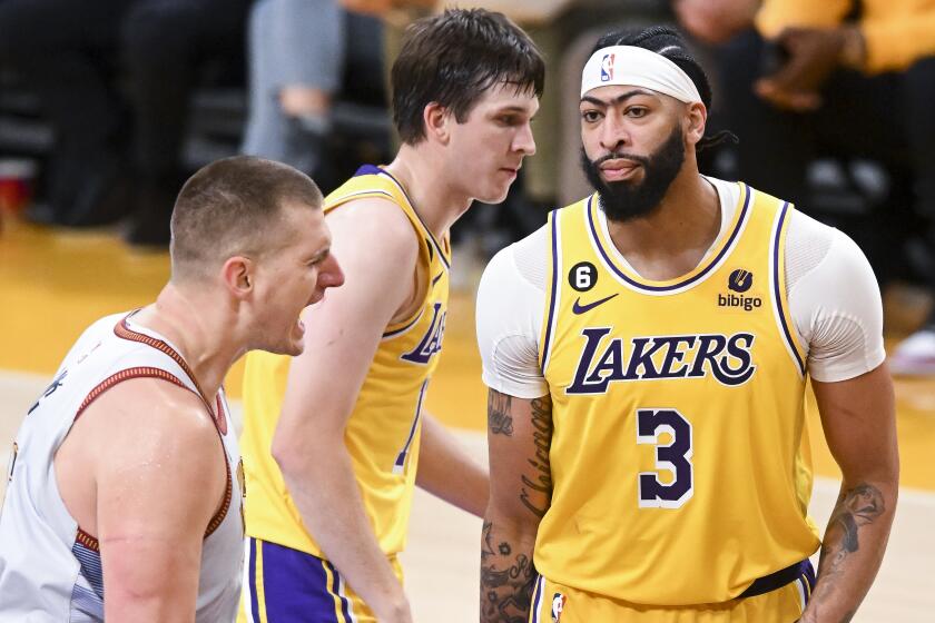 LOS ANGELES, CA - MAY 22: Los Angeles Lakers forward Anthony Davis, right, reacts after a shot made.