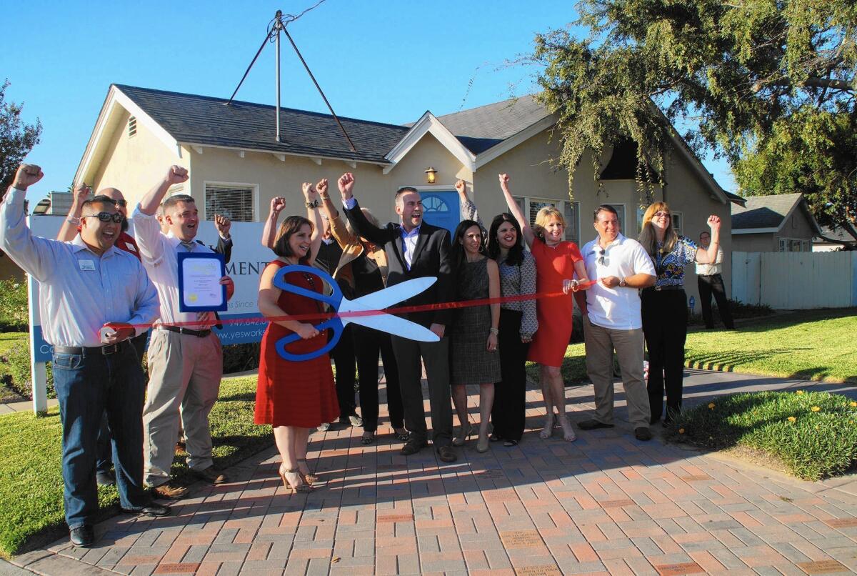 Youth Employment Service of the Harbor Area in Costa Mesa celebrated its 45th anniversary with a small ribbon-cutting ceremony Wednesday outside its East 19th Street offices.