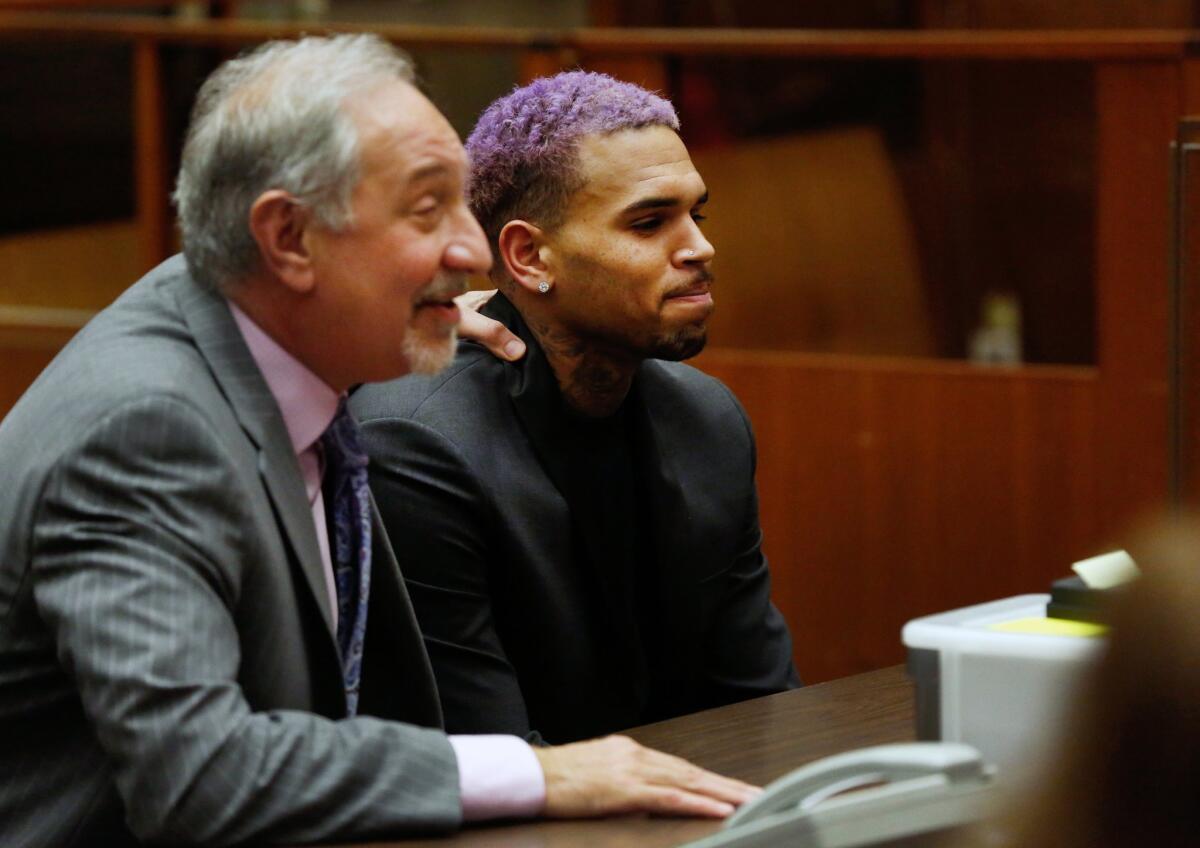 Chris Brown, right, appears with his attorney Mark Geragos, at a Friday court hearing in the R&B singer's long-running case over his 2009 attack on Rihanna.
