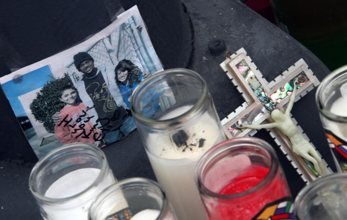 A memorial displays a photo of the brother and sister who were killed Jan. 29, 2015, in a two-vehicle crash at 350 W. Pacific Coast Highway, near Island Avenue in Wilmington.