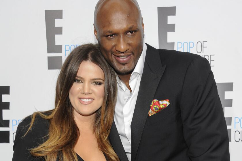 Lamar Odom hopes his divorce with Khloe Kardashian won't go through, the basketball player told Us Weekly. They are pictured in April 2012.