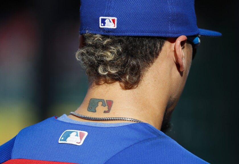Javier Baez sported an MLB tattoo in 2017.