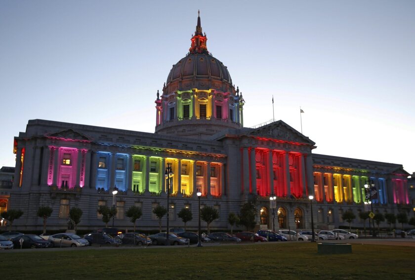 San Francisco City Hall is lit up with the colors of the rainbow flag following the rulings from the U.S. Supreme Court on DOMA and California's Prop. 8 ban on same sex marriages.