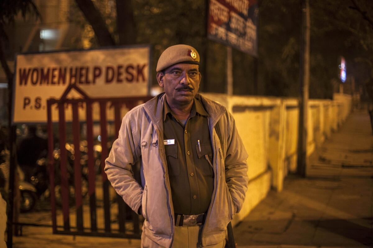 An Indian policeman stands outside the police station that is investigating what authorities says is the gang rape of a Danish tourist in New Delhi.