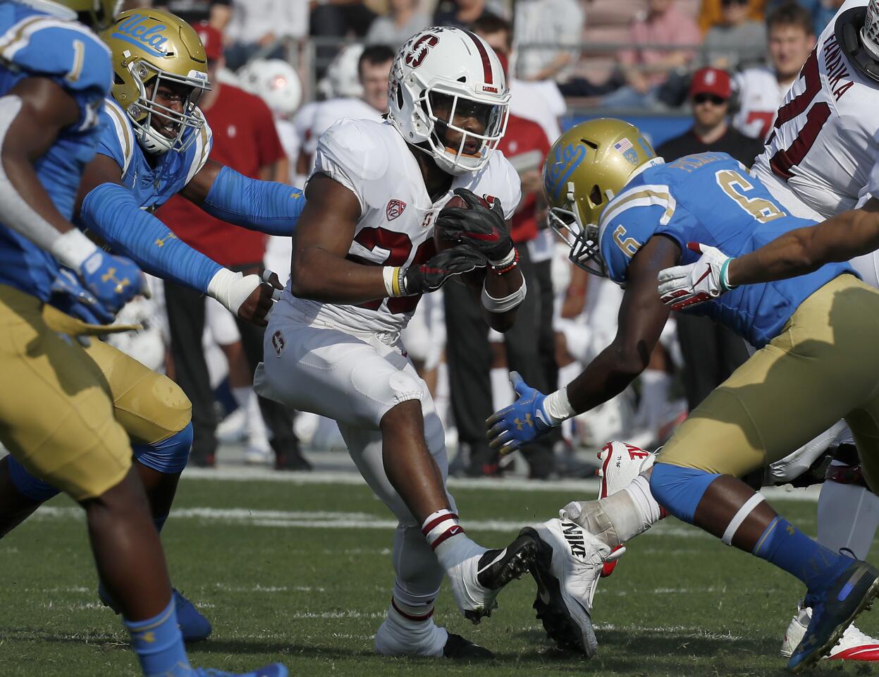 Stanford running back Bryce Love tries to make his way through the Bruins defense during the first quarter.