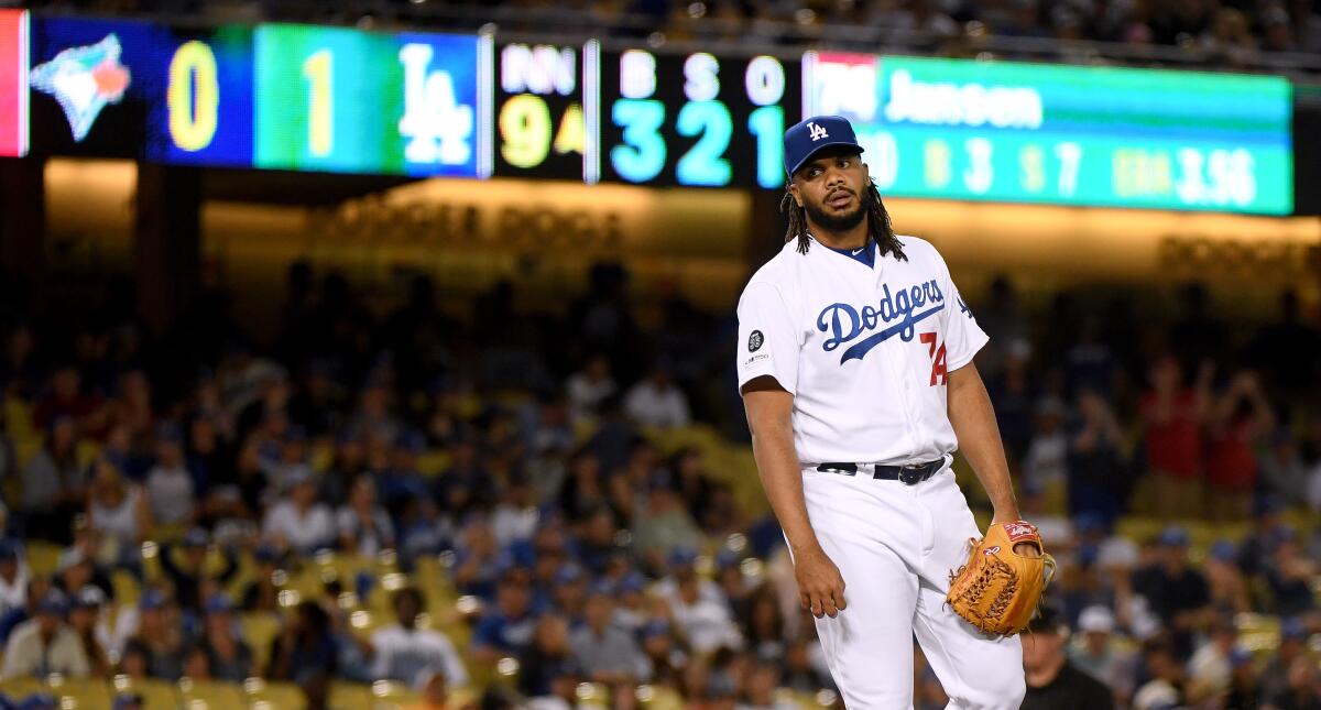 Dodgers' Kenley Jansen reacts after giving up  a solo homerun to Toronto Blue Jays' Rowdy Tellez to tie the game 1-1, during the ninth inning at Dodger Stadium on Wednesday.