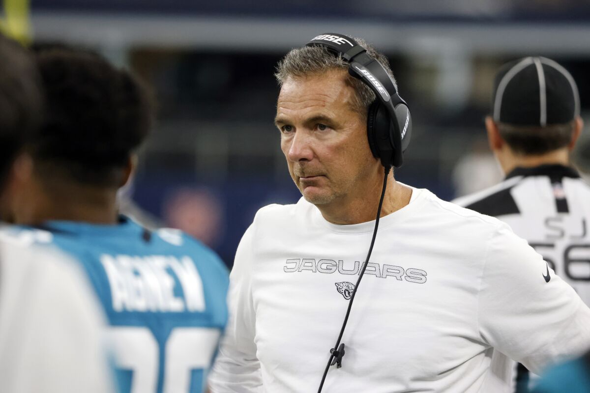 Jacksonville Jaguars coach Urban Meyer stands on the sideline during a preseason game against the Dallas Cowboys.