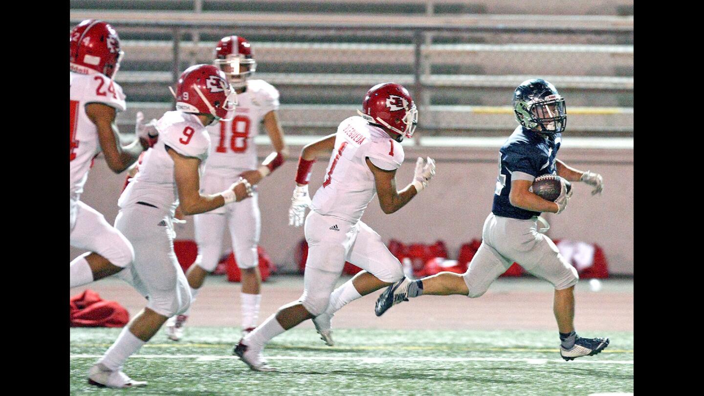 CV's Joe Suh outruns the Burroughs defense for 60 yards to score the first touchdown of the game during a game at Moyse Field on Friday, October 21, 2016.