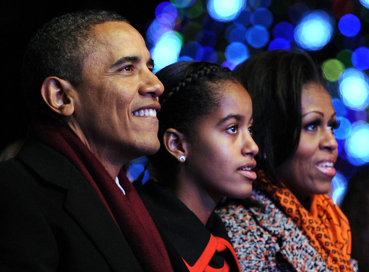 Barack, Malia and Michelle Obama