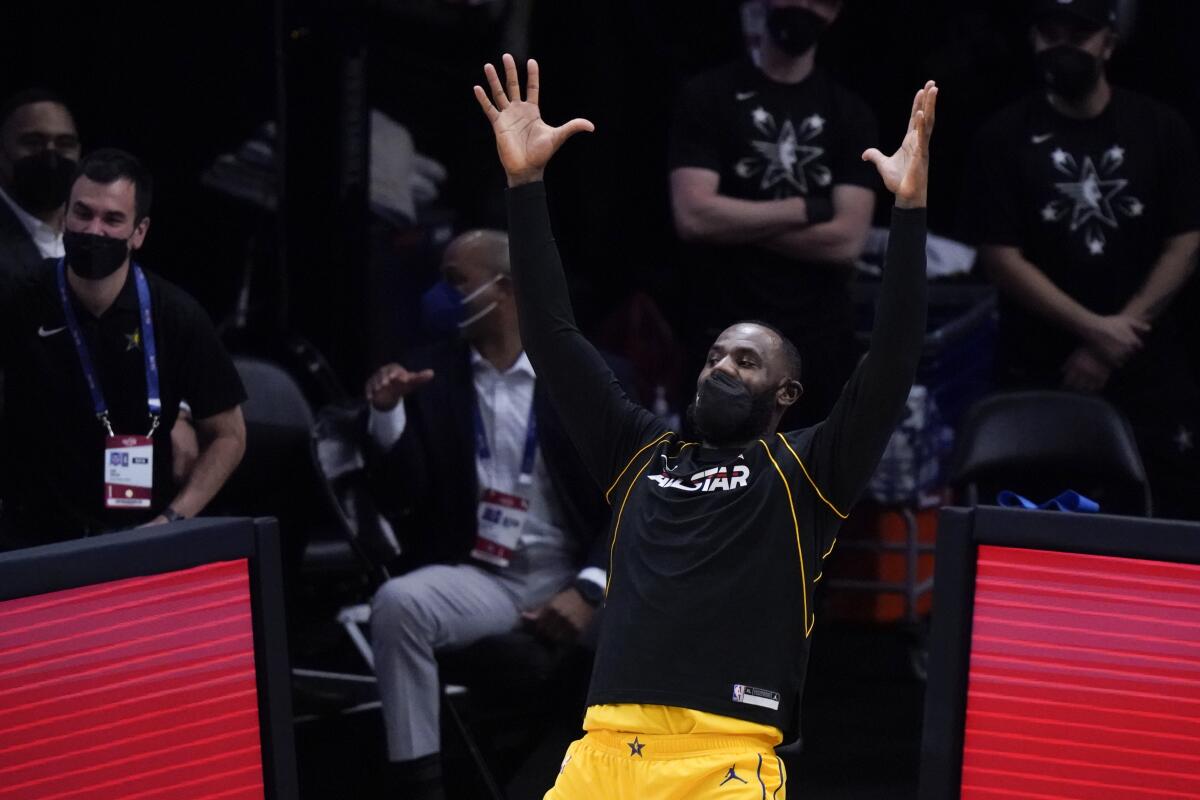 Los Angeles Lakers forward LeBron James celebrates during the first half of basketball's NBA All-Star Game in Atlanta, Sunday, March 7, 2021. (AP Photo/Brynn Anderson)