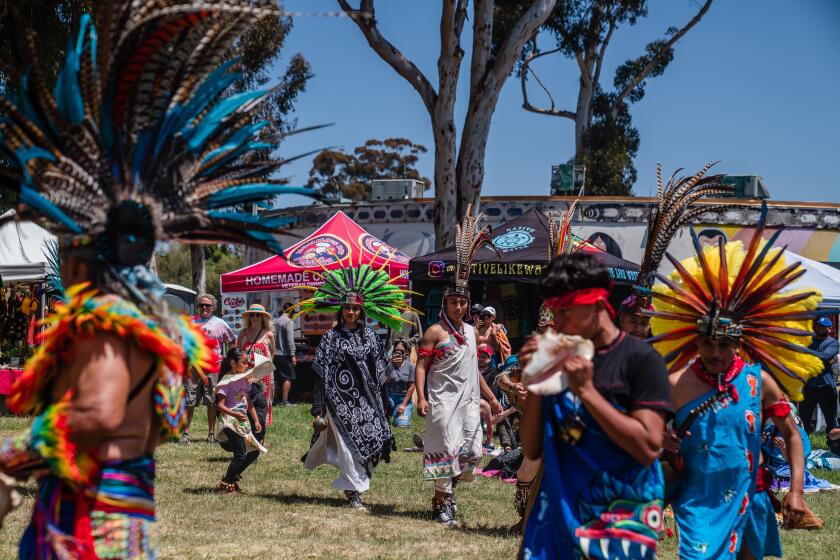 Aztec dancers at the 32nd Annual Multi-Cultural Earth Day Celebration at the WorldBeat Cultural Center in Balboa Park on April 21, 2024. (Ariana Drehsler/For The San Diego Union-Tribune)