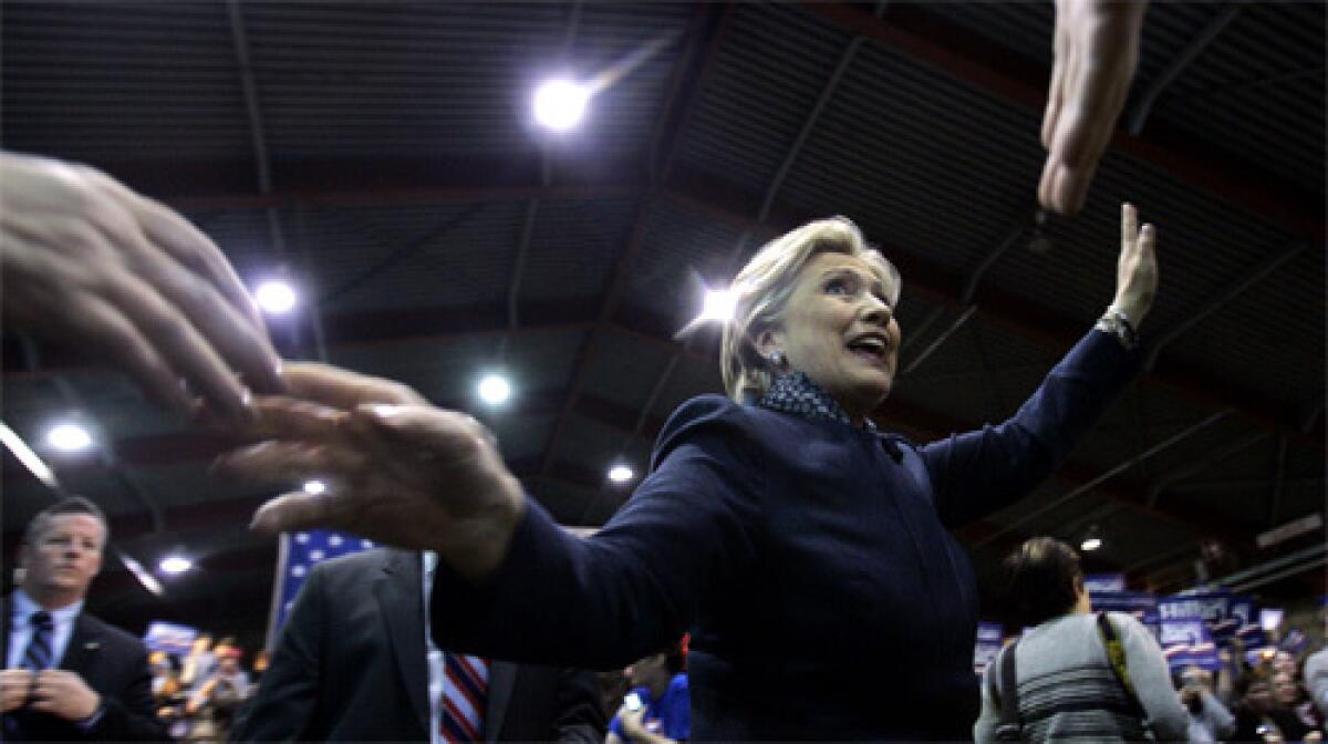 REACHING OUT: Sen. Hillary Rodham Clinton campaigns at Ohio State University. In New Mexico, she scored a belated Super Tuesday victory after a marathon hand count.