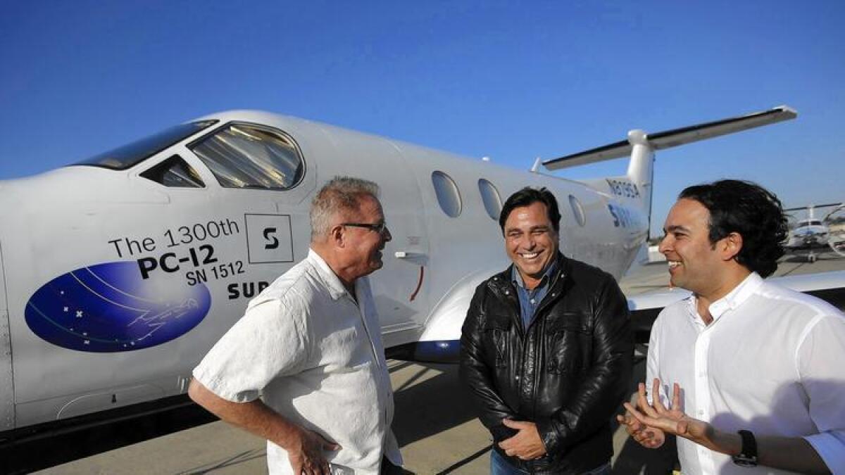 Surf Air CEO Jeff Potter, investor William Woodward and Executive Chairman Sudhin Shahani next to one of the members-only airline's aircraft at Hawthorne Municipal Airport this year.