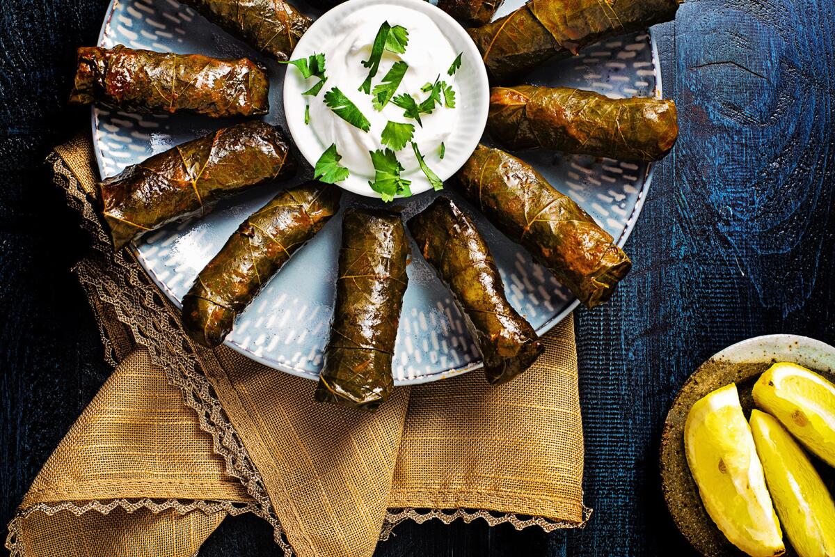 Fresh grape leaves are stuffed with spiced lamb and rice. 