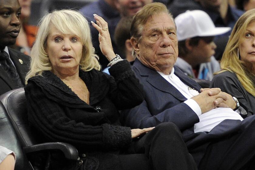 Shelly Sterling sits with her husband, Donald Sterling, during a Clippers game against the Detroit Pistons in 2010.