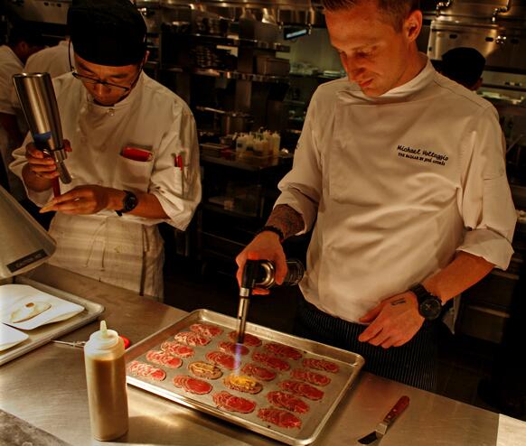 Michael Voltaggio prepares "Philly cheesesteak" tapas at the Bazaar by Jose Andres