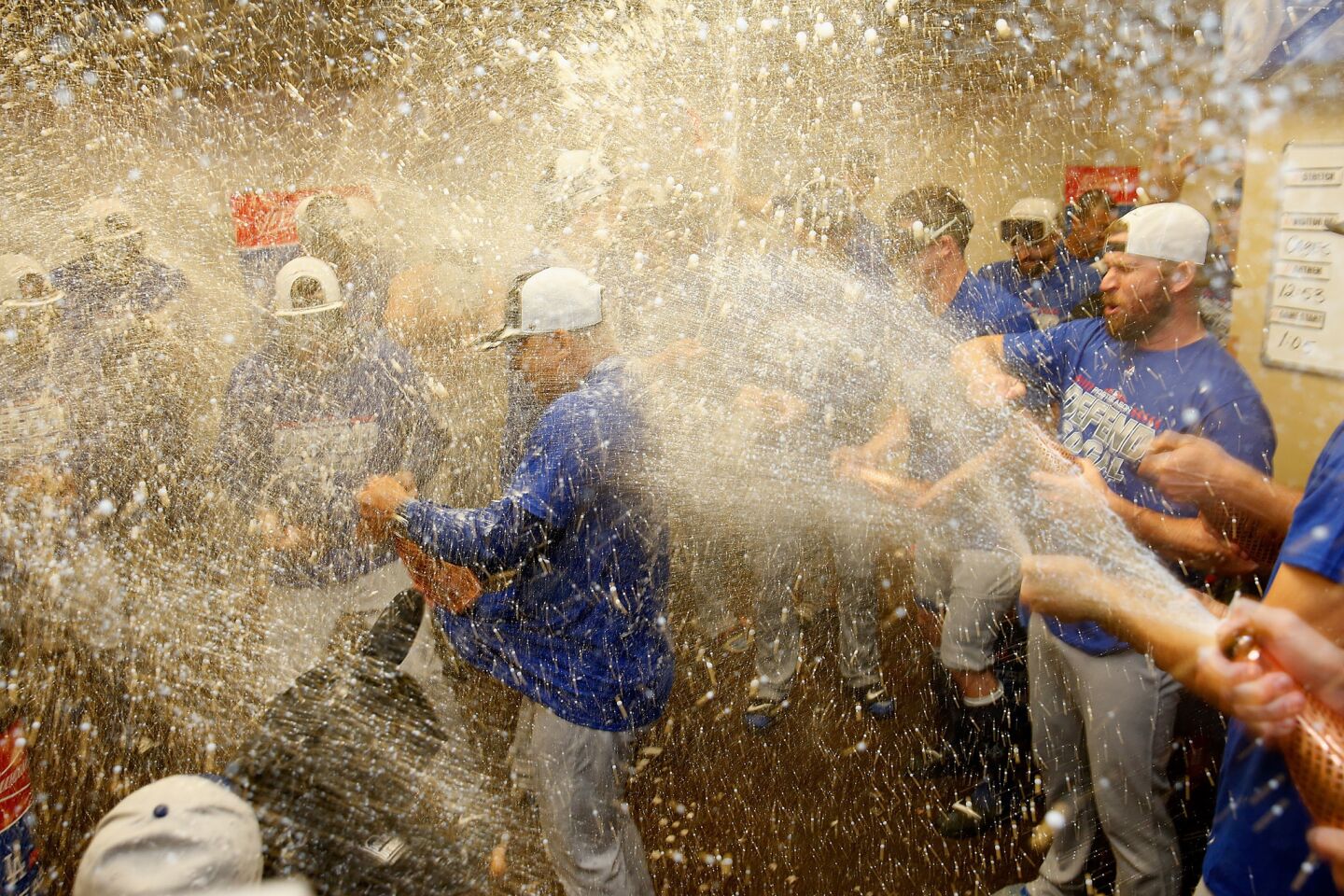 SAN FRANCISCO, CA - SEPTEMBER 29: Manager Dave Roberts #30 of the Los Angeles Dodgers is sprayed with champagne as Dodgers players celebrate after clinching a post season spot by defeating the San Francisco Giants at AT&T Park on September 29, 2018 in San Francisco, California. (Photo by Lachlan Cunningham/Getty Images) ** OUTS - ELSENT, FPG, CM - OUTS * NM, PH, VA if sourced by CT, LA or MoD **
