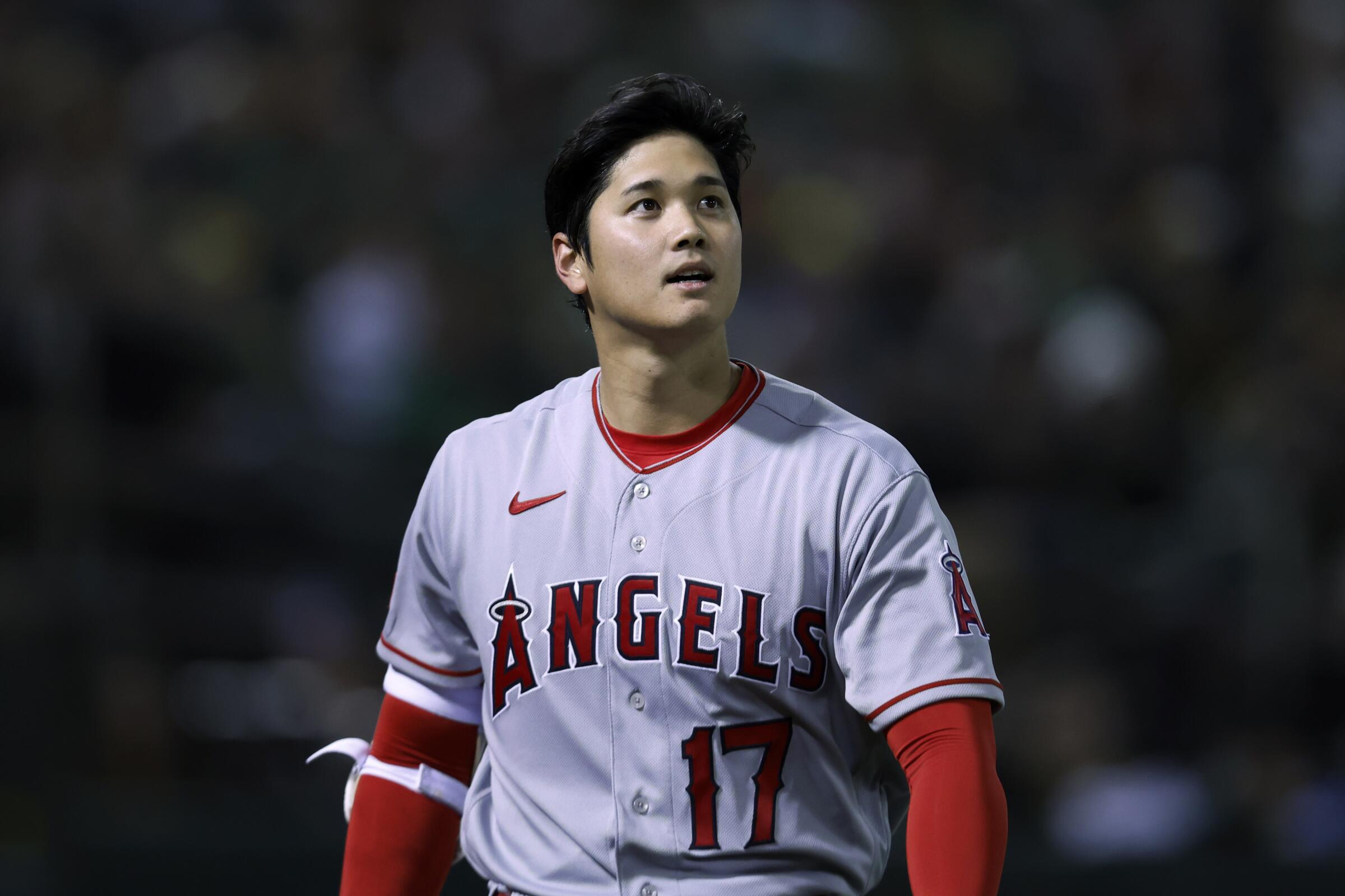 Angels star Shohei Ohtani walks back to the dugout after striking out against the A's on Thursday.