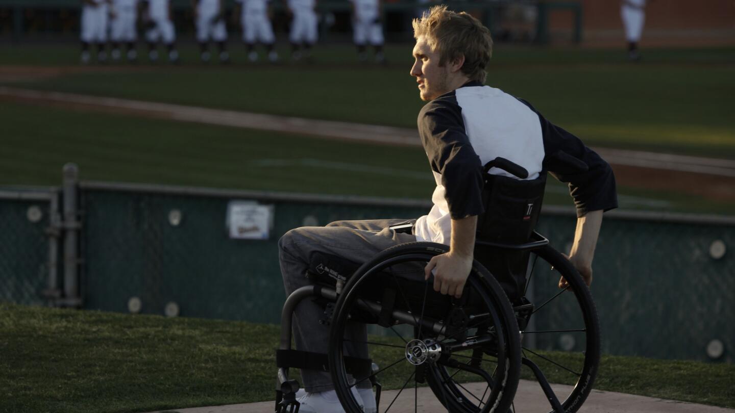 Cory Hahn, who was paralyzed from the chest down while sliding into second base during an early season game last year, watches Arizona State prepare for a game against UC Riverside. Hahn continues his studies while keeping a close tab on the baseball team.