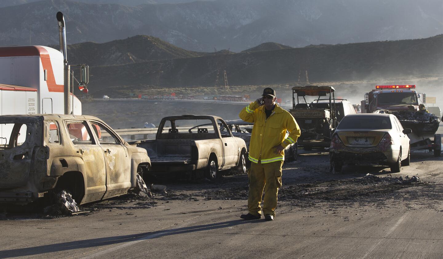 Burned cars sit on southbound Interstate 15 on July 17, 2015, after a fire jumped the freeway, forcing people to abandon their cars in Southern California's Cajon Pass.