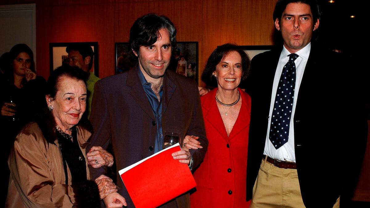 Directors Paul and Chris Weitz pose with their grandmother Lupita Tovar Kohner, left, and their mother, Susan Kohner, in Beverly Hills in 2003.