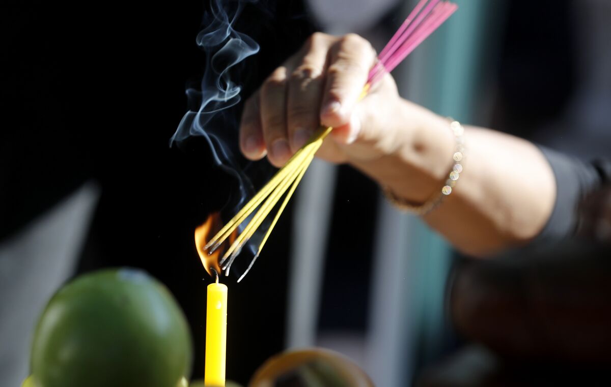 A Buddhist cleansing ceremony is held at the home of fatal shootings