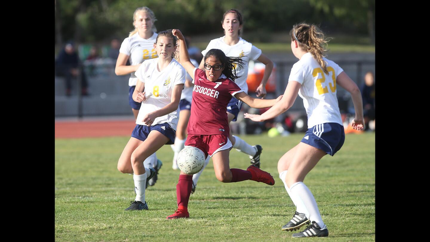 Ocean View's Emily Cabrera, dribbles through Crean Lutheran defenders for a shot, during the wild-card CIF Southern Section Division 4 playoffs on Tuesday.