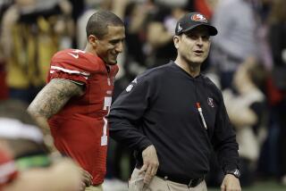 49ers quarterback Colin Kaepernick, left, walks with coach Jim Harbaugh before Super Bowl XLVII against the Ravens