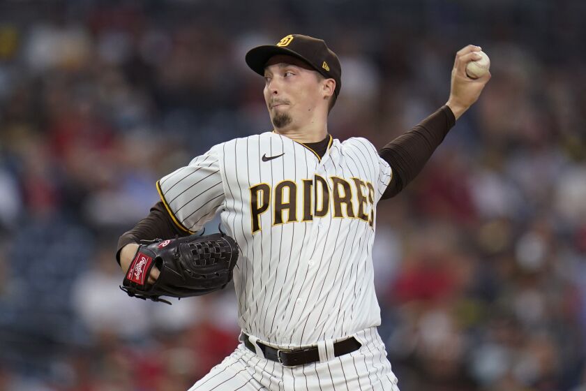 San Diego Padres starting pitcher Blake Snell throws to a St. Louis Cardinals batter during the first inning of a baseball game Wednesday, Sept. 21, 2022, in San Diego. (AP Photo/Gregory Bull)