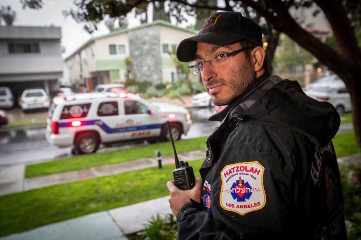 Aharon Sabbagh, an emergency medical technician with Hatzolah, a Jewish volunteer ambulance service that primarily services the Jewish community of Pico-Robertson, waits for a medical call last month in the Beverly Hills area.