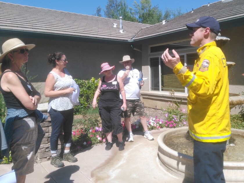 Cal Fire Capt. Thomas Shoots shares tips for maintaining a fire-safe home during the Fire Operations in the Wildland Urban Interface class on Saturday.
