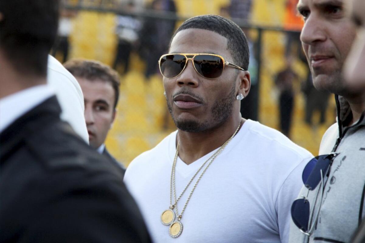Nelly approaches the stage for a concert in Irbil, Iraq, on March 13, 2015.