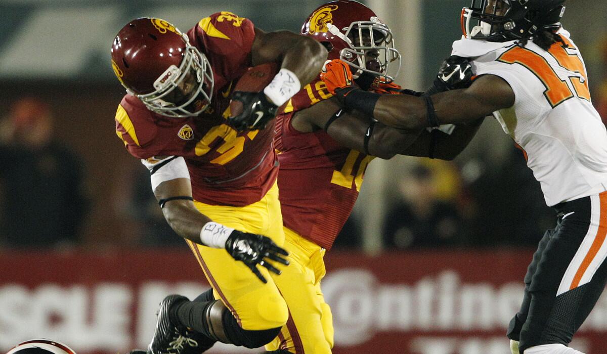 USC running back Javorius Allen (37) gains a first down against Oregon State in the first quarter Saturday night at the Coliseum.