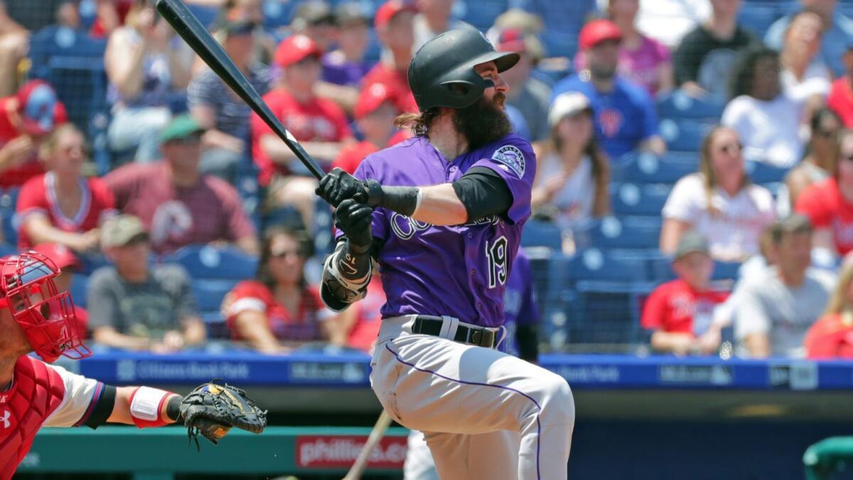 Rockies outfielder Charlie Blackmon hits a solo home run in the first inning against the Phillies on May 19.