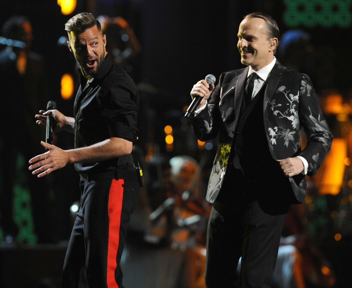 Miguel Bose, right, and Ricky Martin give a fun-filled performance.