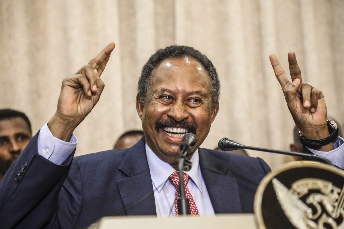 FILE - In this Wednesday, Aug. 21, 2019 file photo, Sudan's new Prime Minister Abdalla Hamdok speaks duringa press conference in Khartoum, Sudan, Wednesday, Aug. 21, 2019. For the first time in three decades, Sudan has charted a path out of military rule with the formation of a transitional government in which power is shared with civilians. But the fragile transition will be tested as leaders confront a daunting array of challenges. Decades of war and corruption have left the economy in shambles, and a U.S. terror designation has hindered Sudan’s return from its longtime status as a global pariah. (AP Photo, File)
