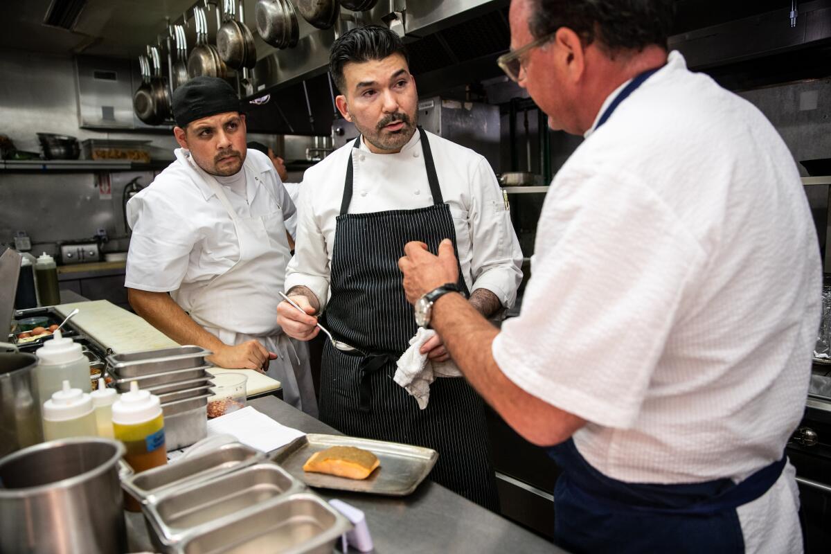 Line cook Jesse Tovar, left, executive chef Richard Archuleta and chef partner Josiah Citrin in the kitchen at Openaire.
