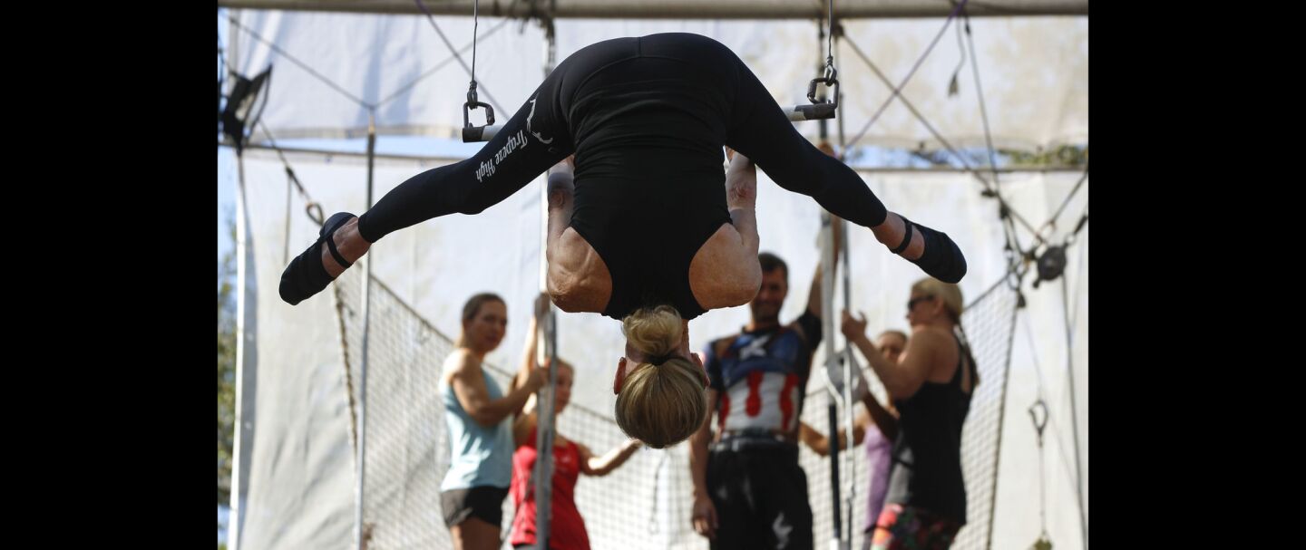 Betty Goedhart, 85, goes upside-down as she swings on a trapeze.