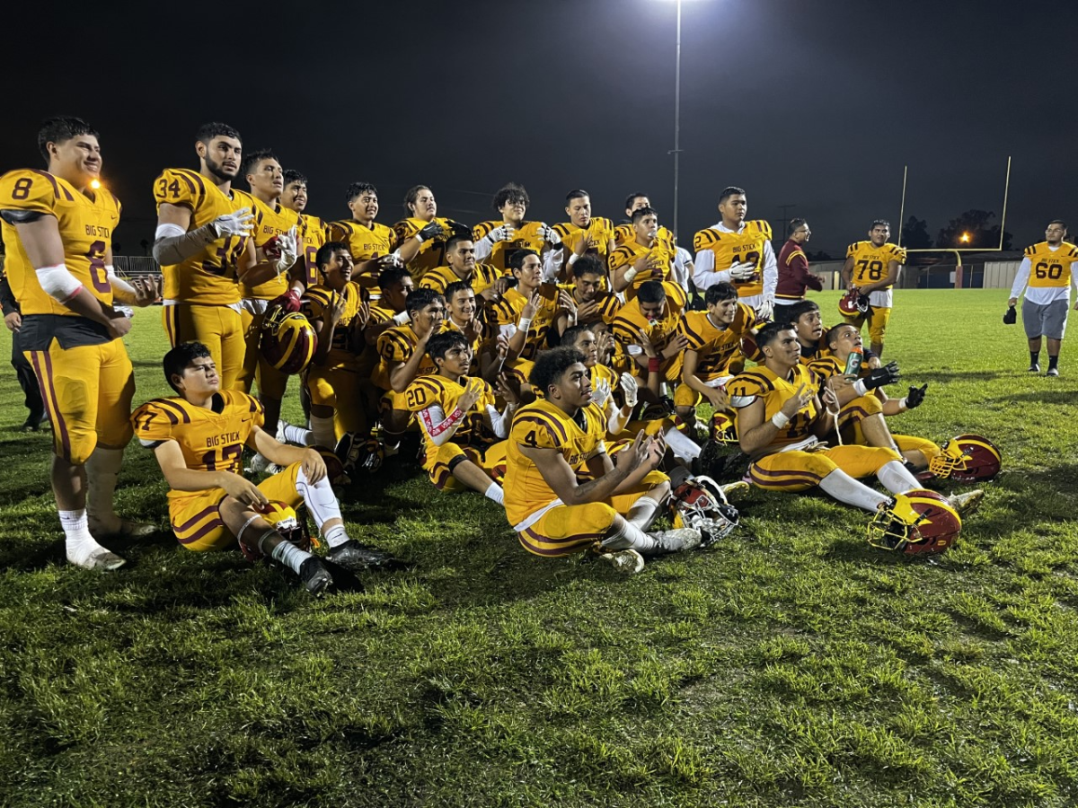 Roosevelt football players celebrate after defeating Dorsey on Friday night.