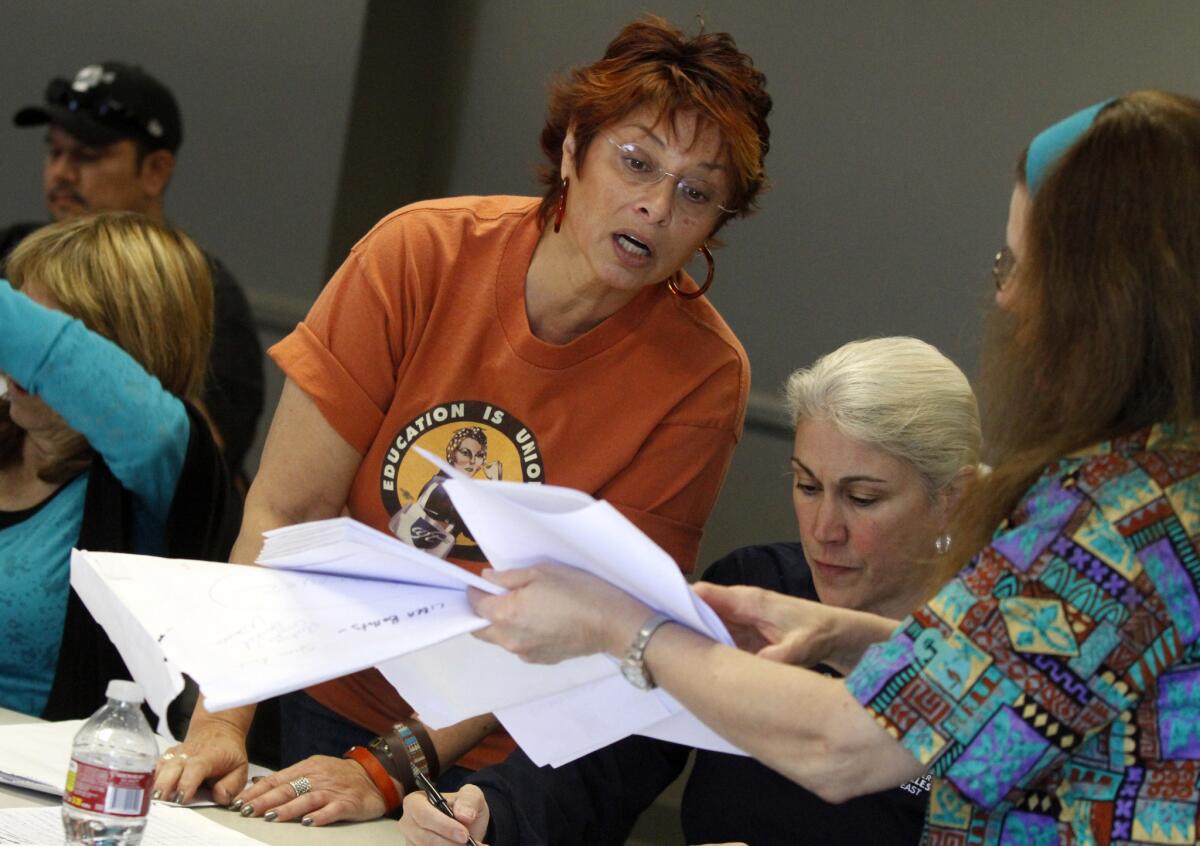 Lisa Karahalios helps tally ballots for an internal union ballot measure in 2013.