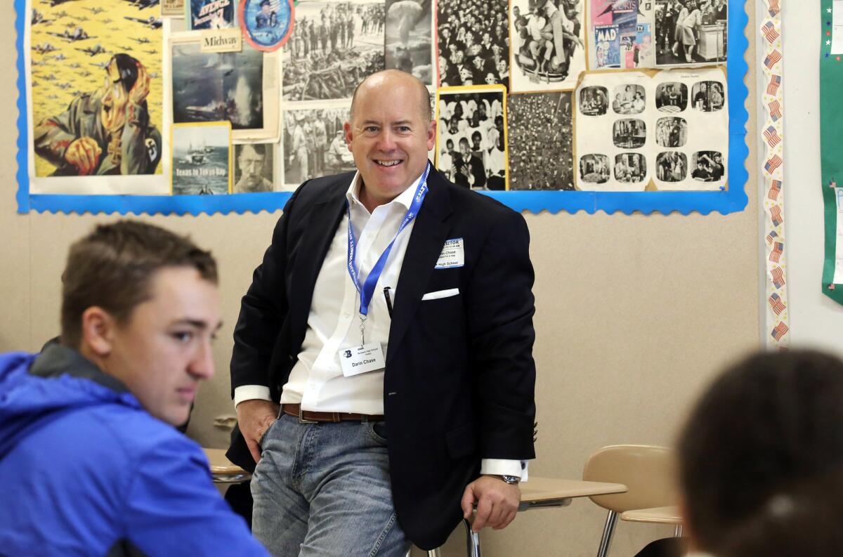 Darin Chase, chairman of the board of the Burbank Chamber of Commerce, talks with students in a government class during Burbank Unified School District's "Senior for a Day" at Burbank High School. Community leaders are paired with a senior high school student to spend time attending classes, touring the campus and learning about the challenges of being in high school in 2019.