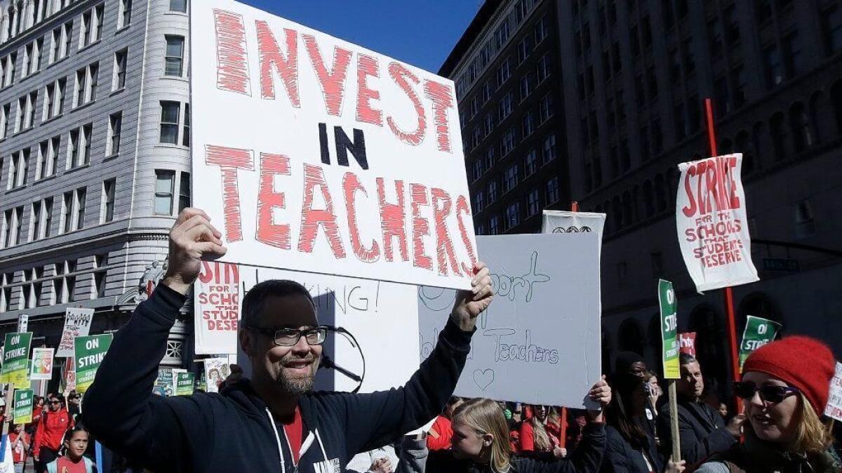 Teachers, students and supporters march in Oakland on Feb. 21.