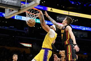 LOS ANGELES, CA - MARCH 18, 2024: Los Angeles Lakers forward Anthony Davis (3) scores.