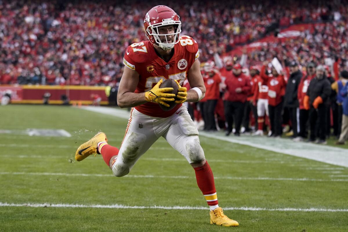 Chiefs tight end Travis Kelce scores a touchdown against the Jaguars during the first half Jan. 21, 2023.
