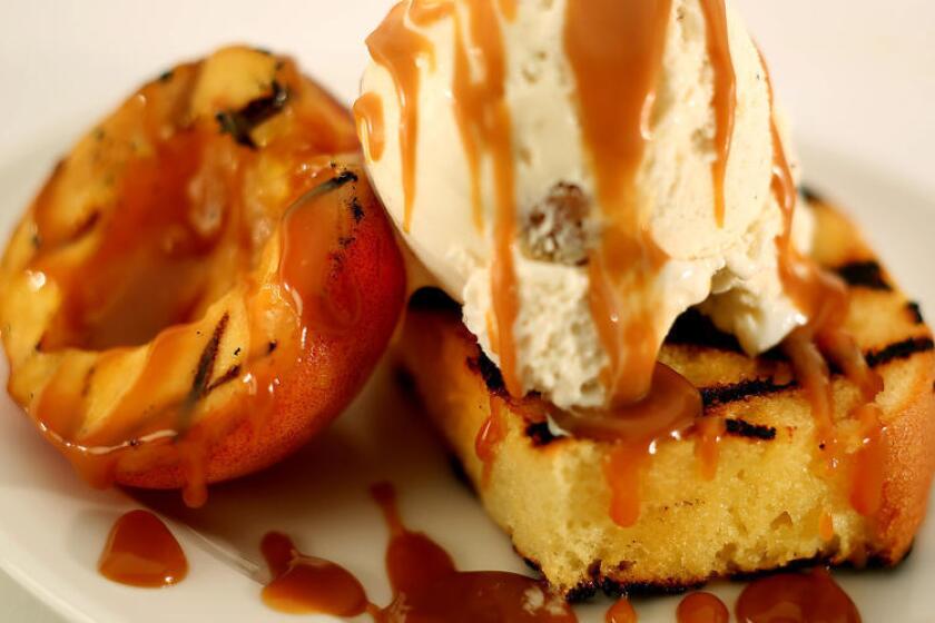 Grilled poundcake with peaches and whiskey caramel sauce